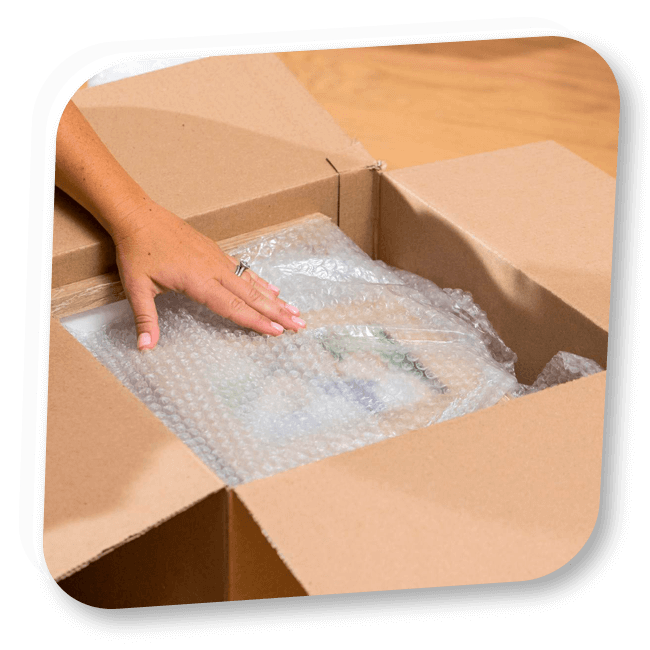 Goods packed in a cardboard box with bubble wrap